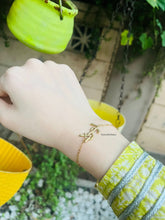 YSL Opyum Charm Bracelet.